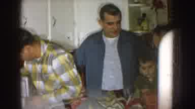 Nebraska (1957): Man Wearing Black And White Shirt With Glasses Sits Near