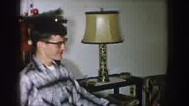 Nebraska (1957): A Man Interacting With Two Women All Pitted On The Sofa