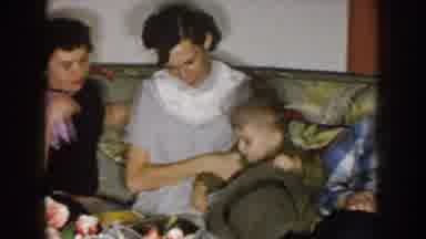 Nebraska (1957): Happy Mom And Dad Prepping Up Their Little Boy With Hat And