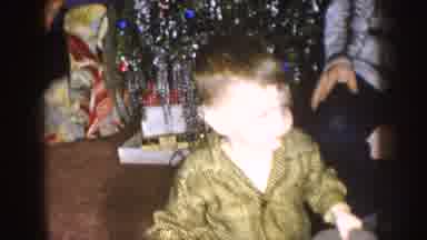 Nebraska (1957): Goofy Child Entertains His Family During Their Christmas