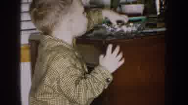 Nebraska (1957): Boy Is Looking For Something Special Indoors Is Leaning On The
