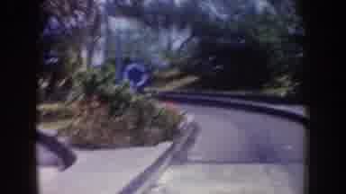 Disneyland California (1962): People Wearing Funny Hats Drive In Small Cars Down A