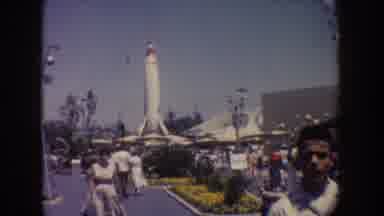 Disneyland California (1962): Theme Park With People Walking And A Large Rocket In