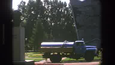 Denmark (1975): A Big Truck With A Tank On The Back Of It And The View Of A Large