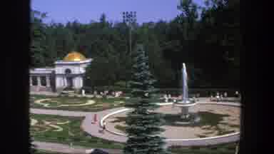 Denmark (1975): A Park With A Big Fountain A Church And People Walking