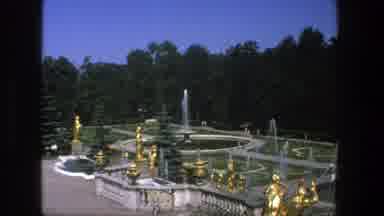 Denmark (1975): Golden Statues Overlook A Garden Filled With Walkways And Water