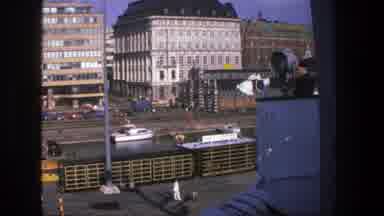 Denmark (1975): Tall Buildings With People In The Background And Soon Afterwards