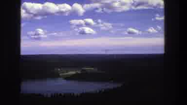 Denmark (1975): Aerial View Of Blue Lake Sky And Puffy White Clouds