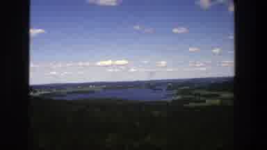 Denmark (1975): Lake View From A Hill With Woods And Blue Sky With Clouds