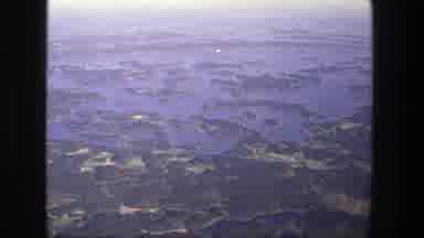 Denmark (1975): Aerial View Of Green Trees And Blue Lake Water On A Clear Day