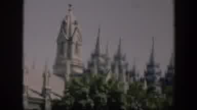 Wyoming (1951): A Large White Castle Surrounded By Trees As People Walk By