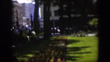 Wyoming (1951): View Of People Walking By Black Object Near Green Trees On A