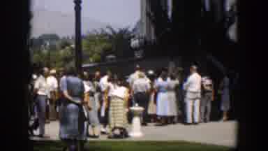 Wyoming (1951): Large Crowds Gather Near Gray Object On A Bright Sunny Day