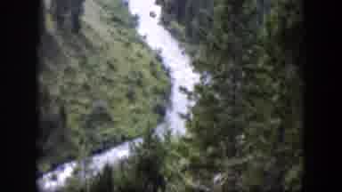 Wyoming (1951): Winding Mountain Stream Runs Down Forested Mountain Hill Through