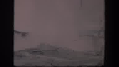 Wyoming (1951): View Of Geyser Steam And Gray Rocks On A Cloudy Day