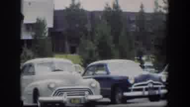 Wyoming (1951): Vintage Cars In Some City Parking Lot One Gray And One Blue Very