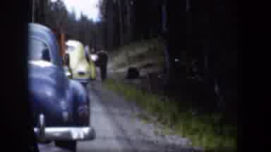 Wyoming (1951): Old Cars In The Road With People Nears One Of This
