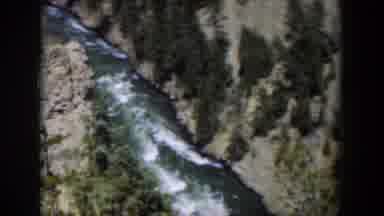 Wyoming (1951): View Of Rushing River Brown Mountains And Green Trees On A Sunny