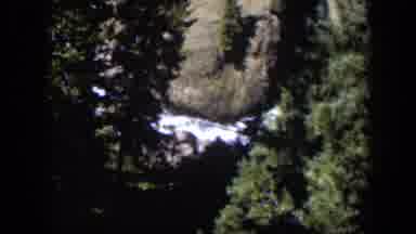 Wyoming (1951): Rushing Water That Can Be Seen Through Trees Next To Rocks
