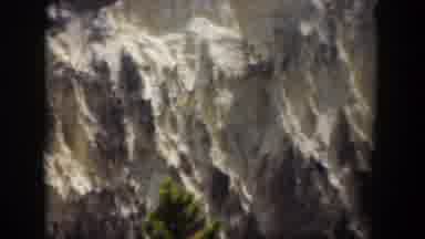 Wyoming (1951): View Of Snow Covered Mountains And Green Trees On A Sunny Day