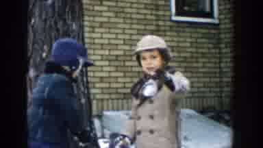 Michigan (1957): Two Young Boys Outside In The Snow One Pointing At The Camera The