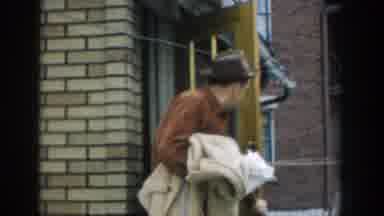 Michigan (1957): Man Looking Over His Shoulder Then A Woman Walking Out The Door