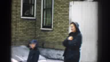 Michigan (1957): Grandma Holding Baby Adjusting Clothing