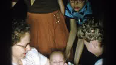 Michigan (1957): A Little Girl Kissing A Baby In The Hand Of A Women While People