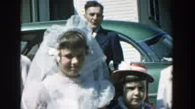 Michigan (1957): A Family Dressed Up For A Festivity In A Sunny Day