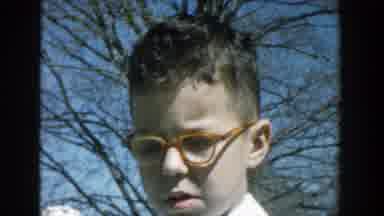 Michigan (1957): A Boy With Glasses On His Face Stands Besides A Little Girl With