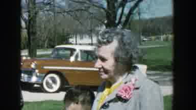 Michigan (1957): An Elderly Woman Interact With Another Woman In The Midst Of Men