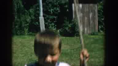 Michigan (1957): Baby Plays On The Swing While A Little Girl Takes Off Her Straw