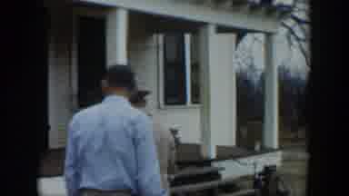 Cuba-1951: Two Men Searching On Porch With Bicycle