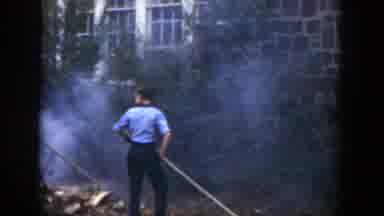 Cuba (1951): Young Boys Burning Leaves Behind A Stone House In Backyard Film