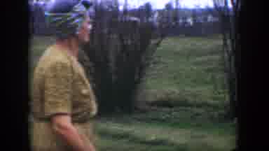 Cuba (1951): Two Ladies One In Yellow And The Other In Purple Clothes Walking To