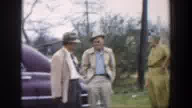Cuba (1951): People Who Are Dressed Up And Socializing Outside On A Windy Day
