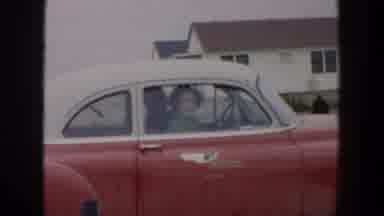 Cuba (1951): A Man And A Woman Inside A Red Car Waiting For Something