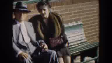Cuba (1951): Elderly Man In Elegant Clothes Suit And Hat Sitting In A Park Talking
