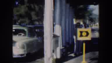 Cuba (1951): View Of Two Parked Dark Blue Cars On A Bright Sunny Day