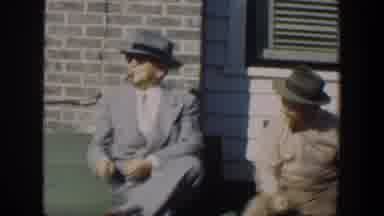 Cuba (1951): Two Old Men Wearing Suits Hats And Glasses Sitting On A Wooden Bench