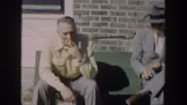 Cuba (1951): Three Men Sitting On Bench Are Smoking And Two Of Them Are Wearing