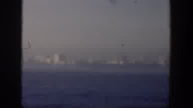 Cuba (1951): View Of White Buildings And Blue Ocean Water On A Hazy Day