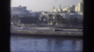 Cuba (1951): Vehicles Driving On A Road Near A Body Of Water