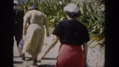 Cuba (1951): People Dressed Up Walking By The Harbor