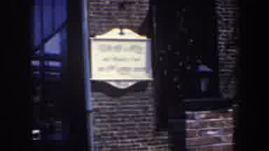 Philadelphia Pennsylvania (1962): Dark color Brick House Entrance White Sign Next