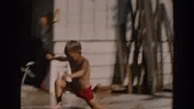 North Hollywood California (1962): A Little Boy Wearing A Short Jumps Into The