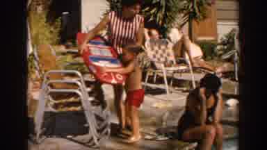 North Hollywood California (1962): Lovely Little Boy Picking Up Big Toy To Play