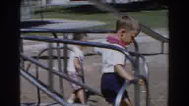 North Hollywood California (1962): Two Boys Play On A Metal Merry-Go-Round And