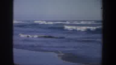 San Francisco California (1957): Waves Roll In Towards Shore Woman With Scarf On