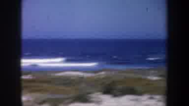 San Francisco California (1957): Passing View Of Blue Ocean Water And Tan Beach On